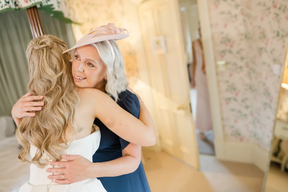 Holly embraces a guest during the morning preparations.