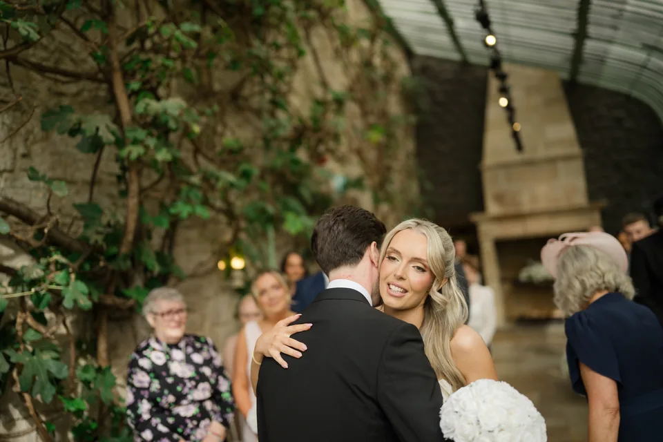 Holly embraces a guest before the ceremony.