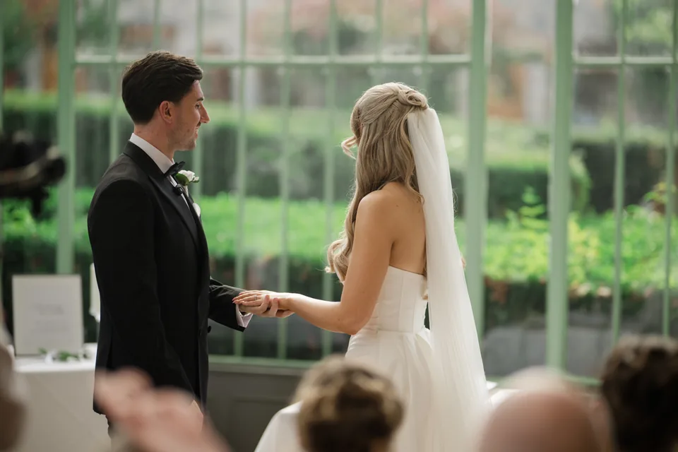 The couple faces each other for the vows.