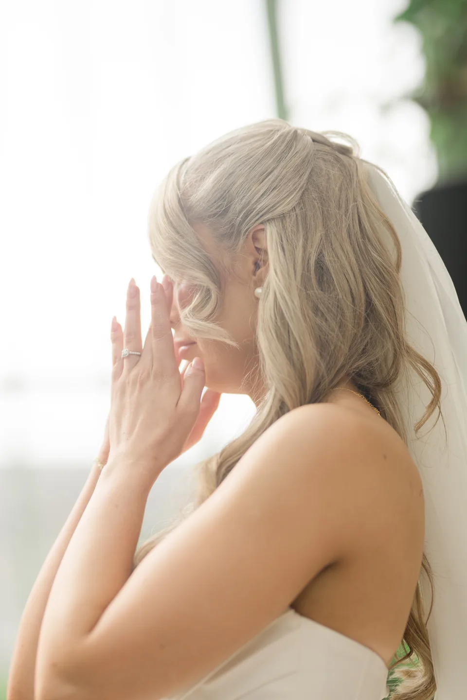 Holly wipes away tears during the vows.