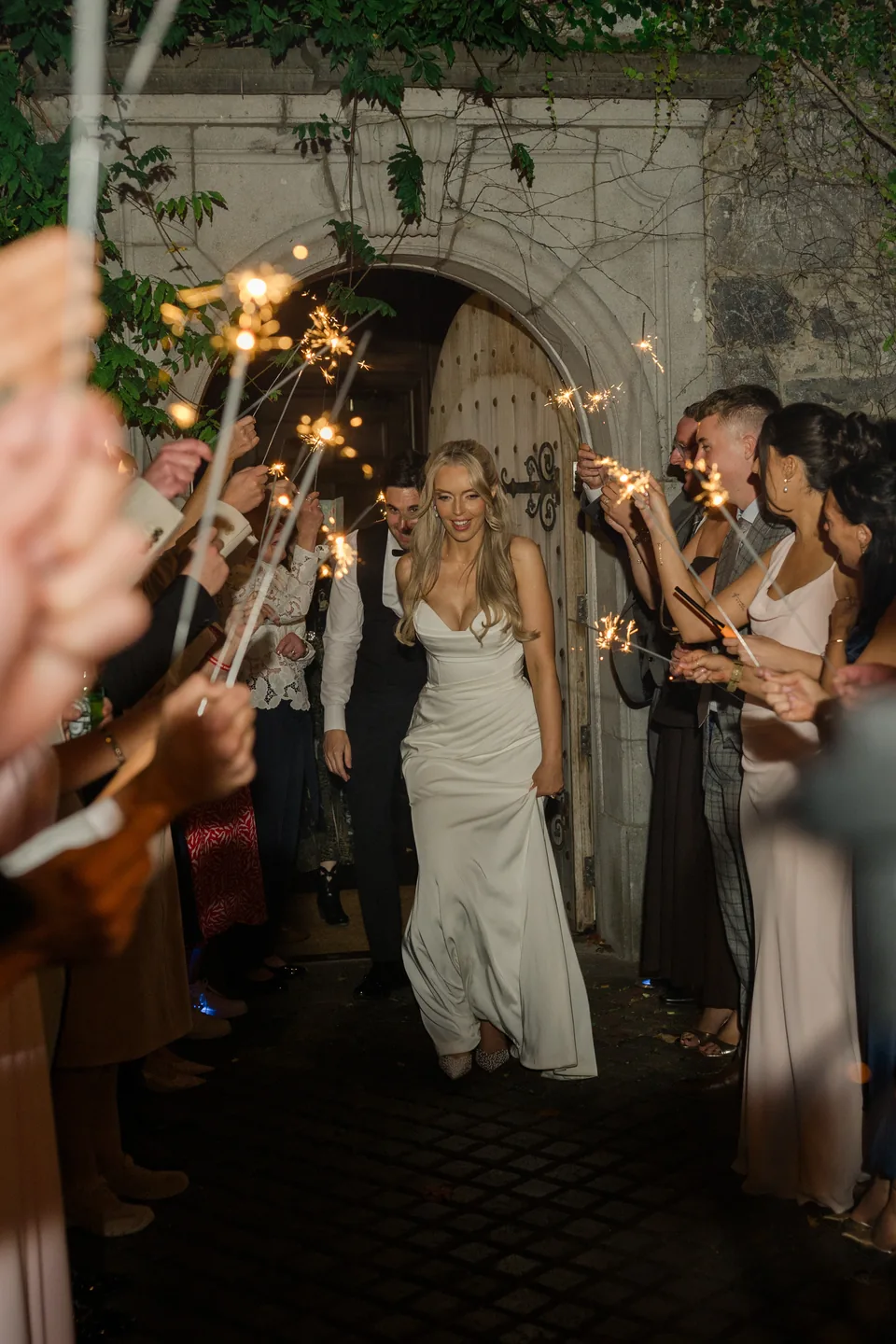 The sparkler entrance sets the evening scene.