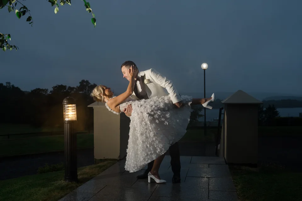 Ieva and Darren sharing a dip outside Manor House Country Hotel at blue hour
