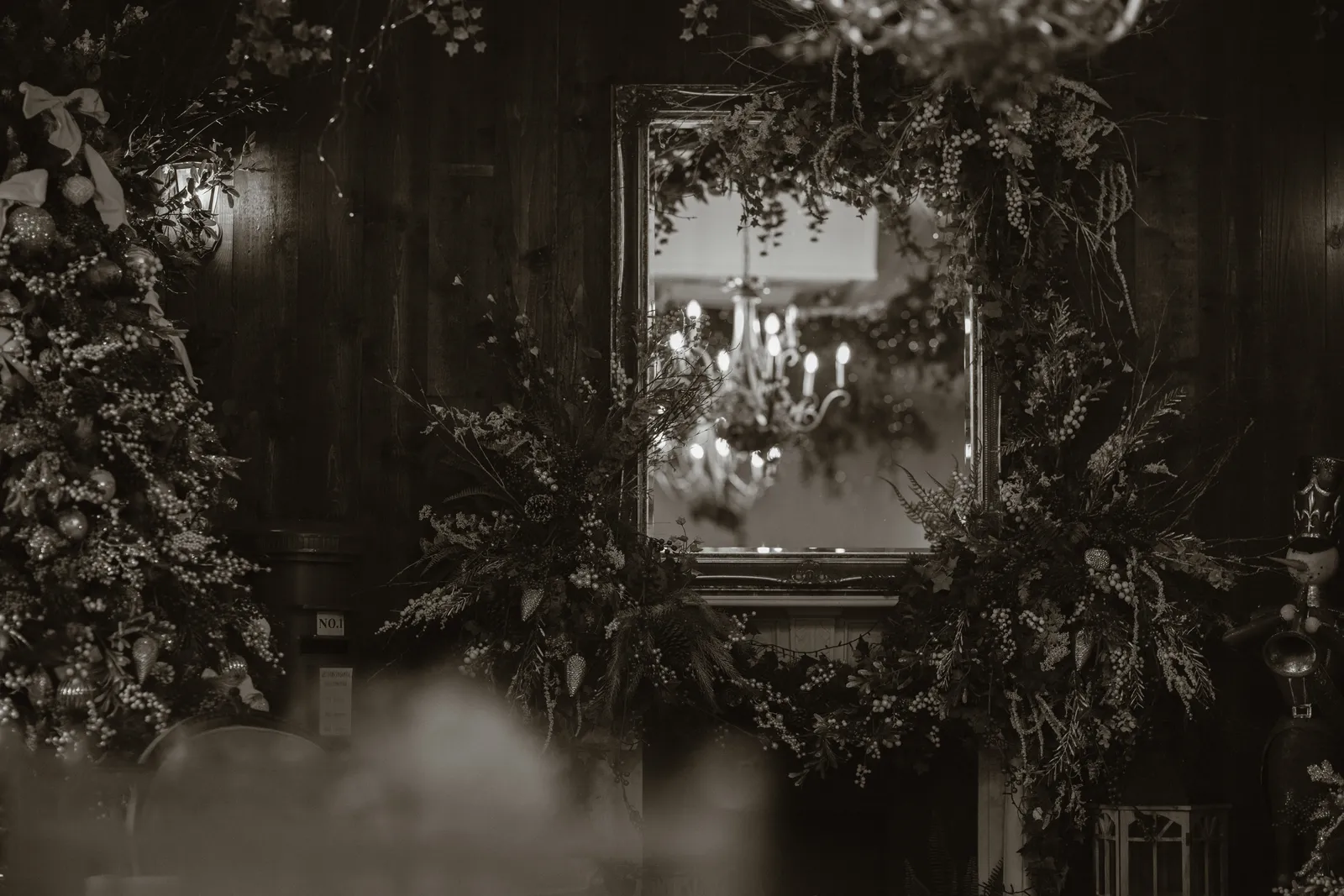 A mirror framed by greenery