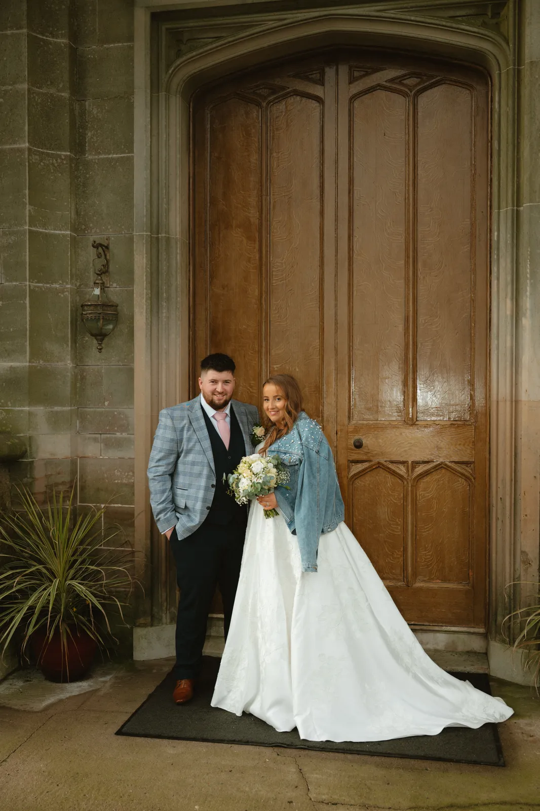 The couple at the castle entrance