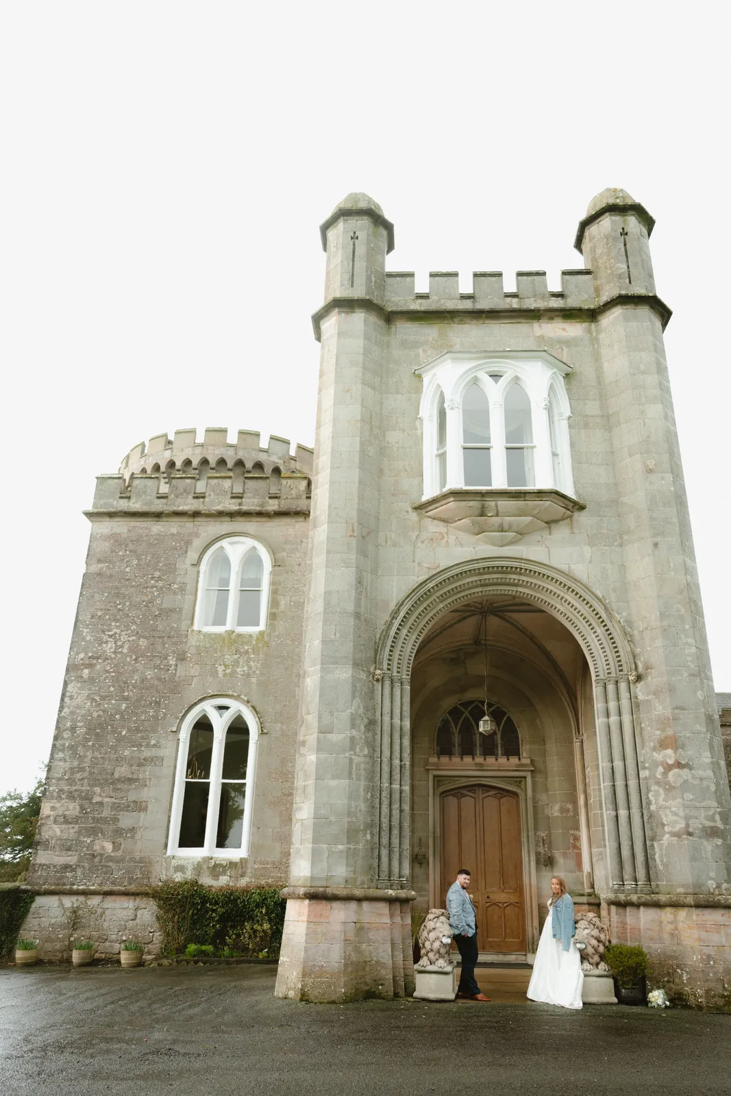 The castle exterior and the couple