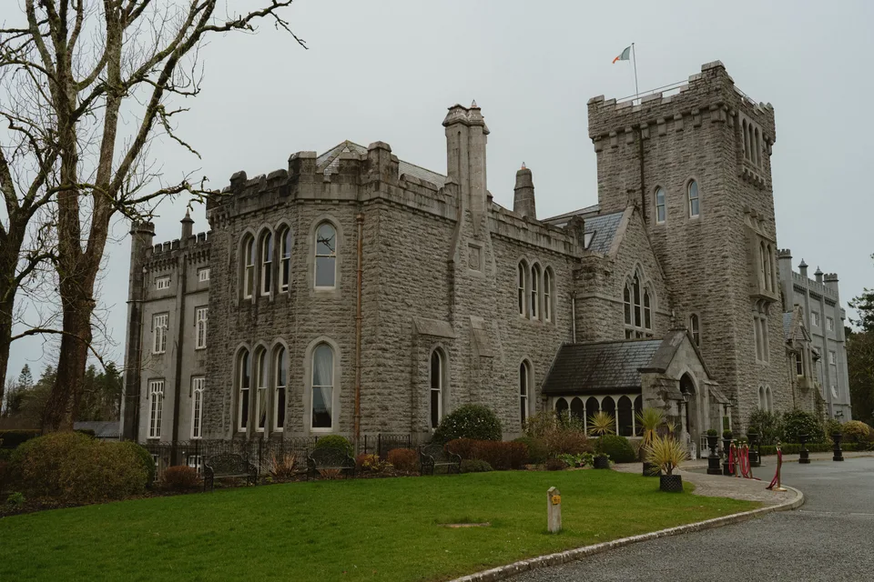 The stone exterior and lawns of Kilronan Castle Estate.