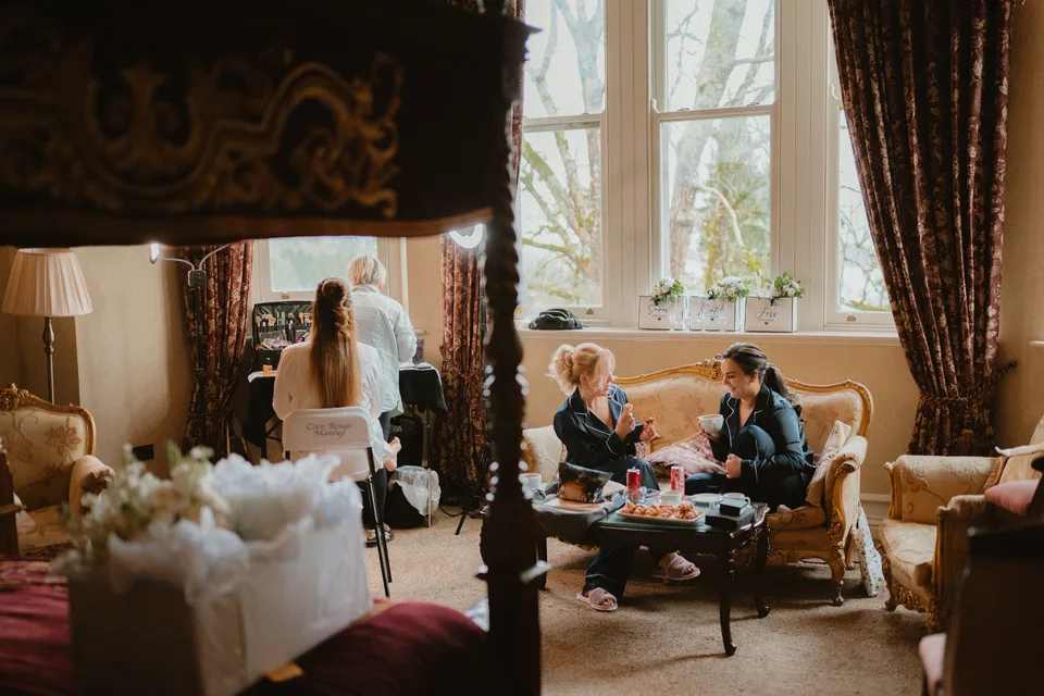 Lynsey and her bridal party getting ready beside the castle bedroom windows.