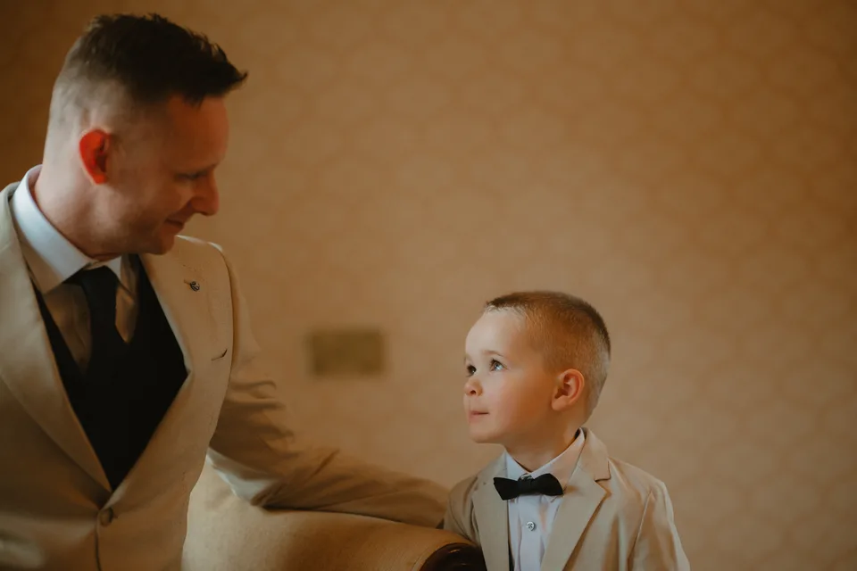 Jamie exchanging a glance with a young member of the wedding party.