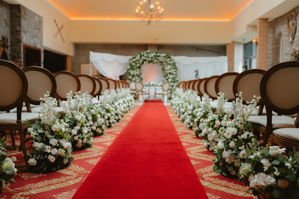 The flower-lined red aisle ready for Lynsey and Jamie’s wedding ceremony.