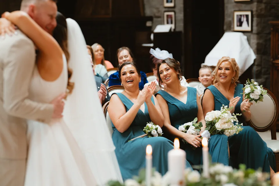 Lynsey’s bridesmaids applauding during the ceremony.