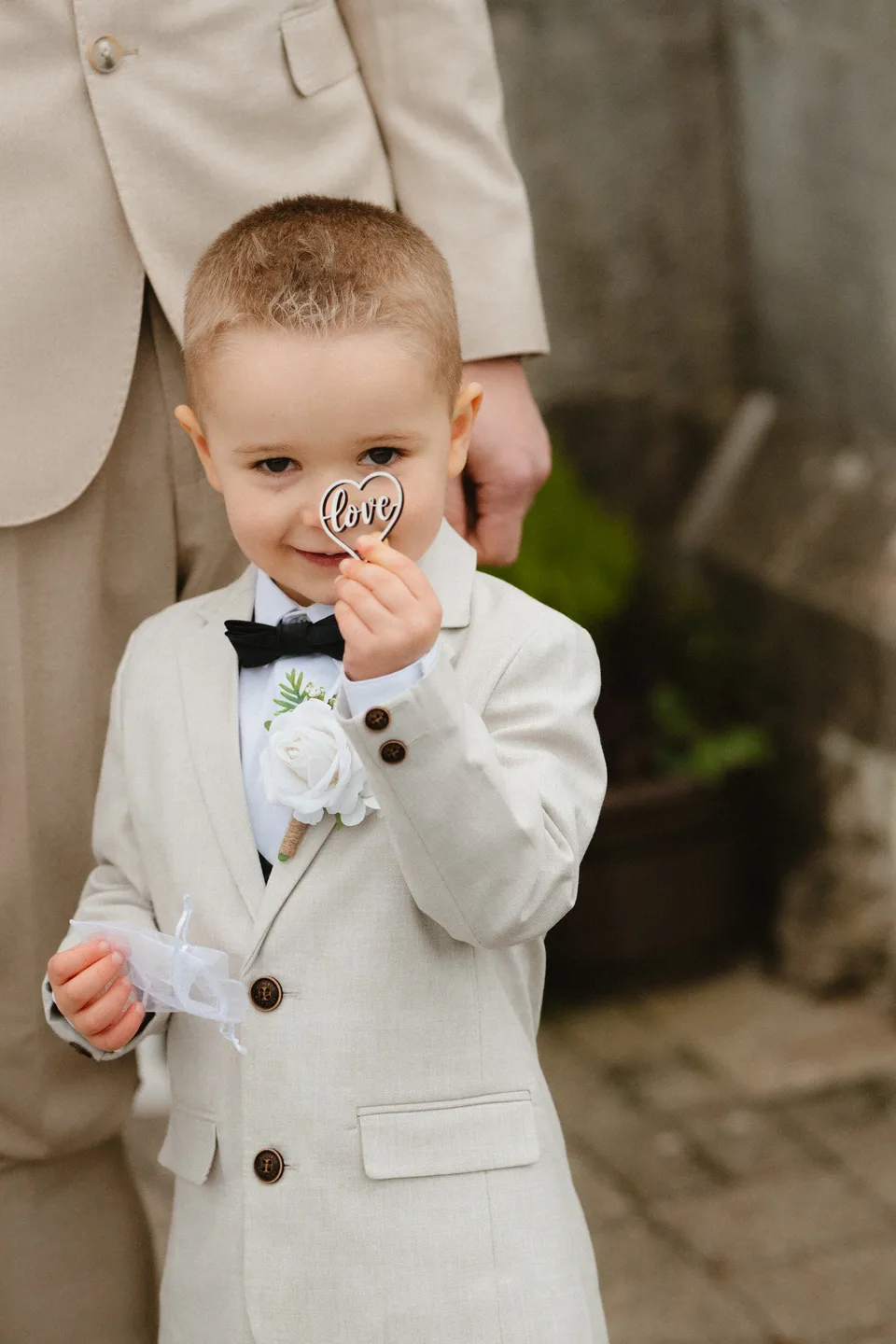 A young wedding guest enjoying an ice cream.