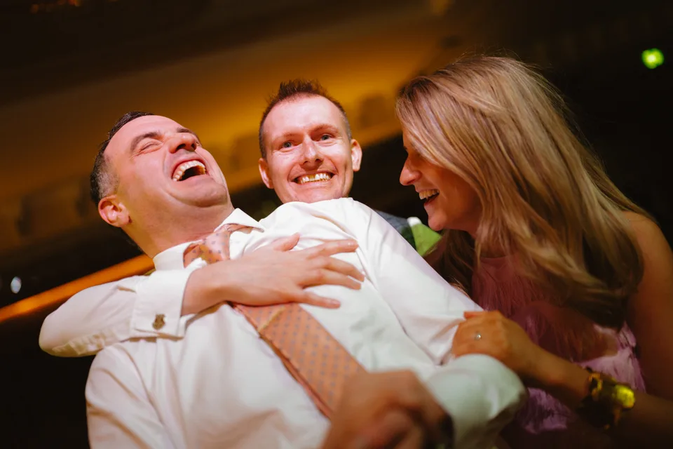 Laughter as a young guest is lifted up during the dancing.