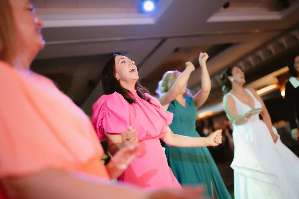 A guest in pink joining the evening dancing.