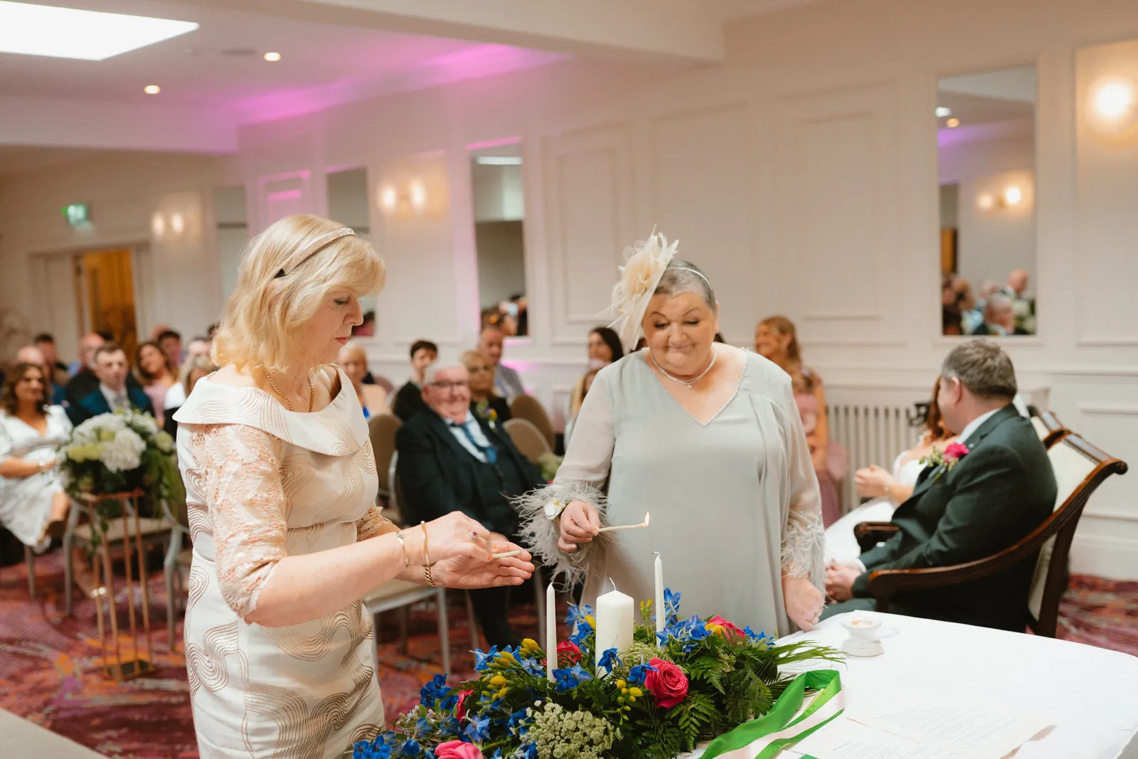 Candles being lit at the ceremony table