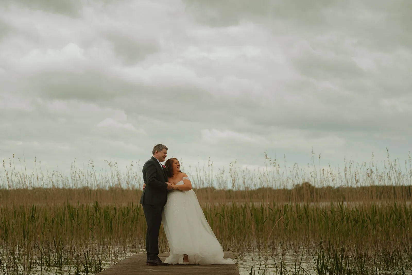 Michelle and Ray together on the lakeside jetty at Bloomfield House Hotel