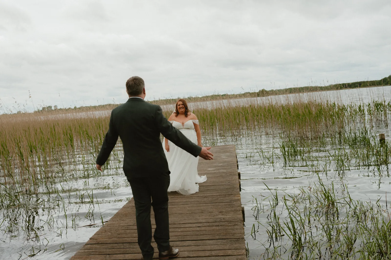 Ray walking towards Michelle along the jetty