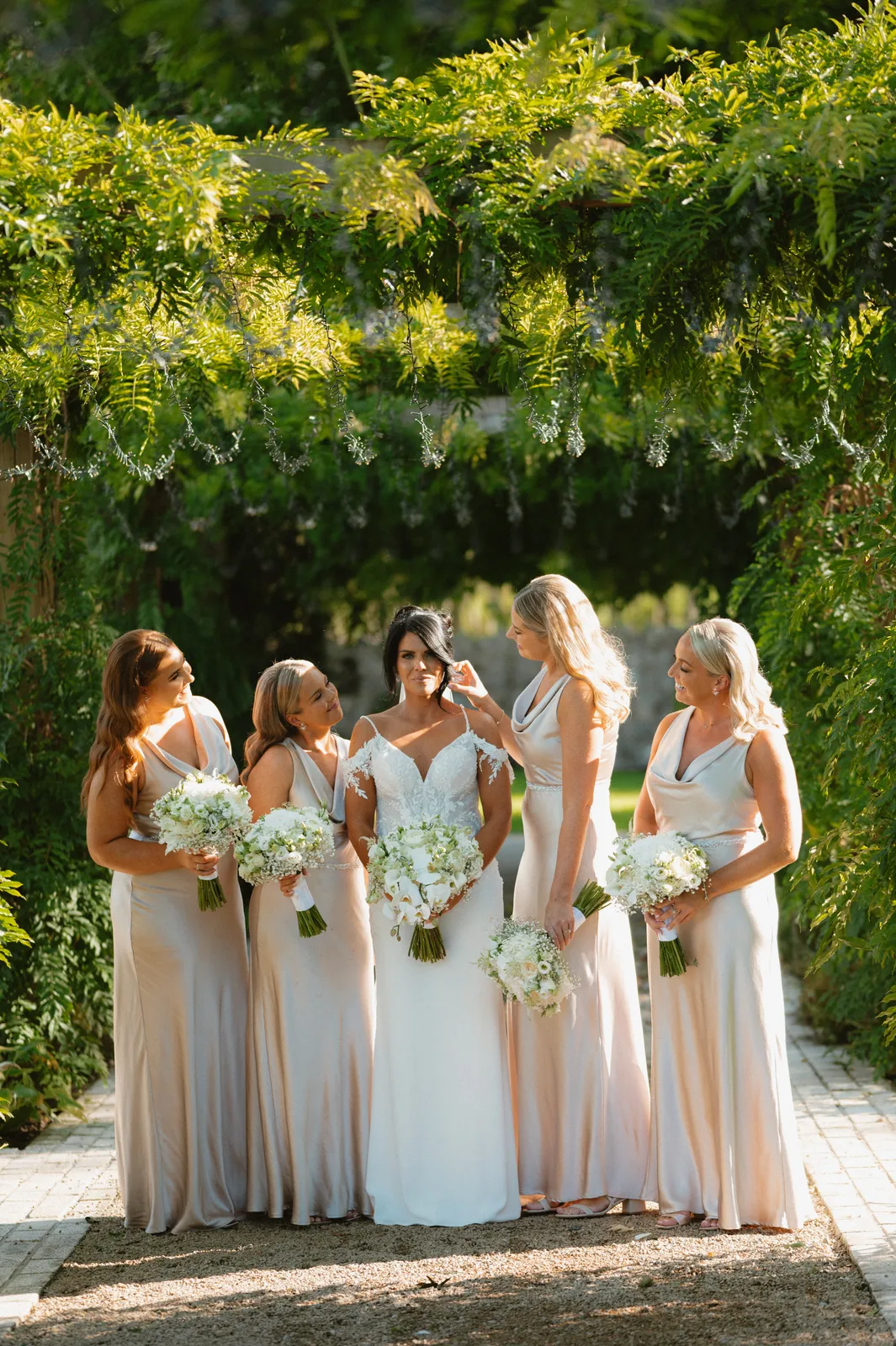 Nicola with guests and bouquets