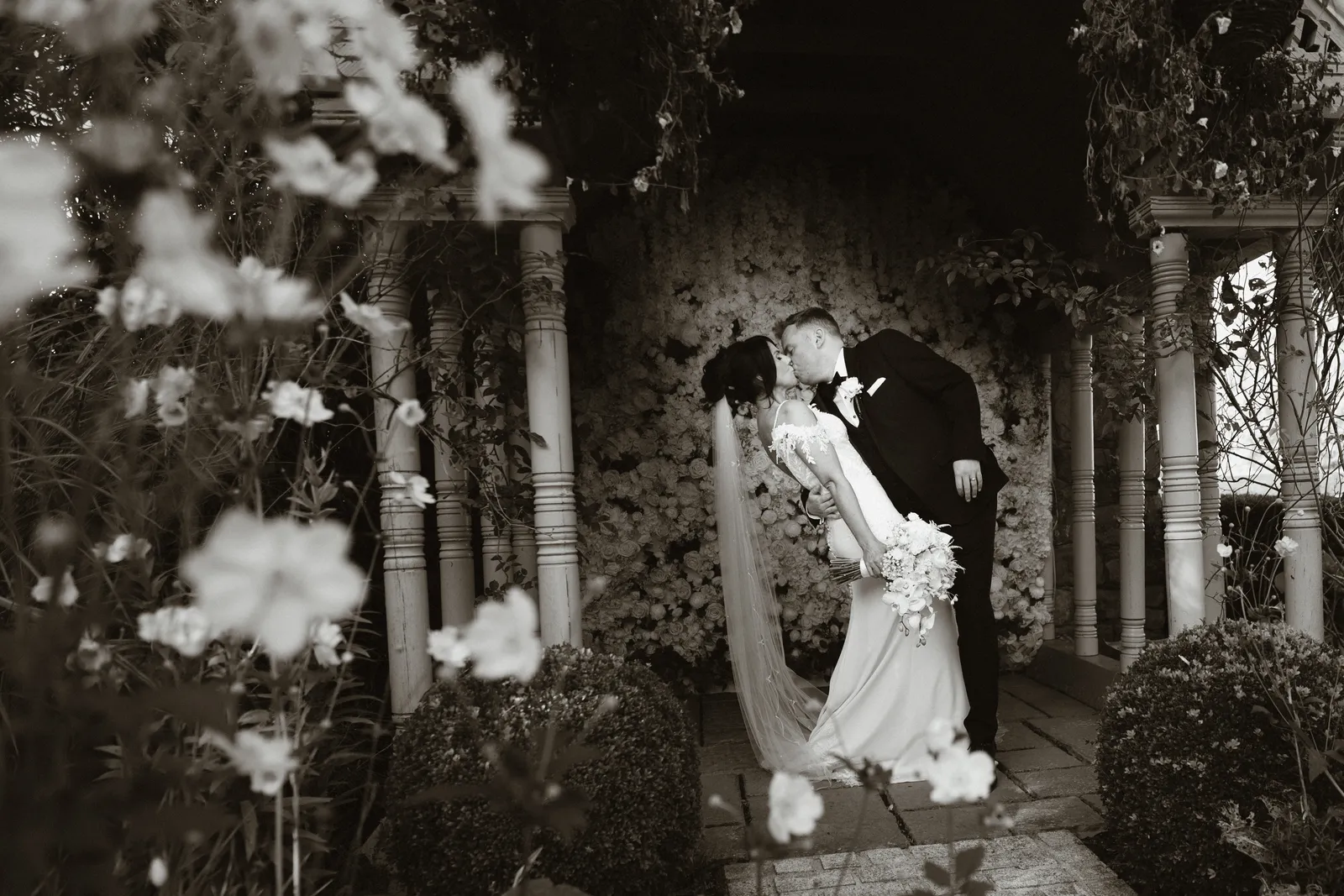 The couple together beneath the garden roof
