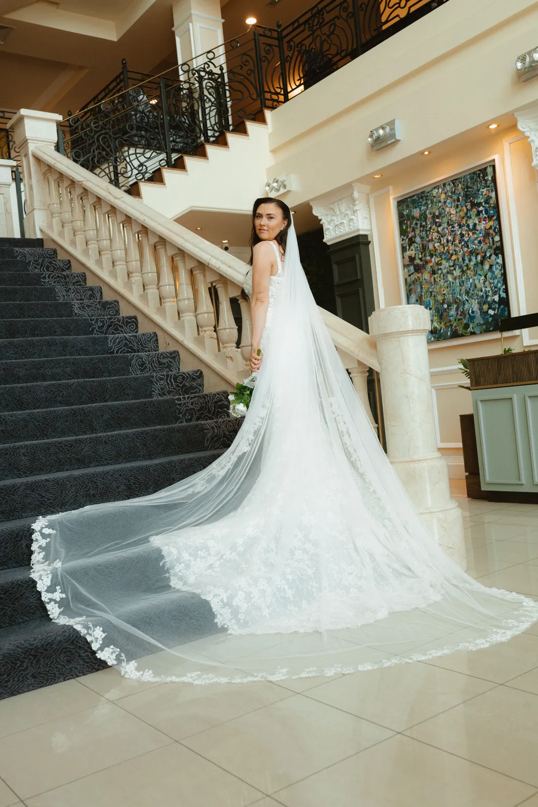 Nicola and her dress on the hotel staircase