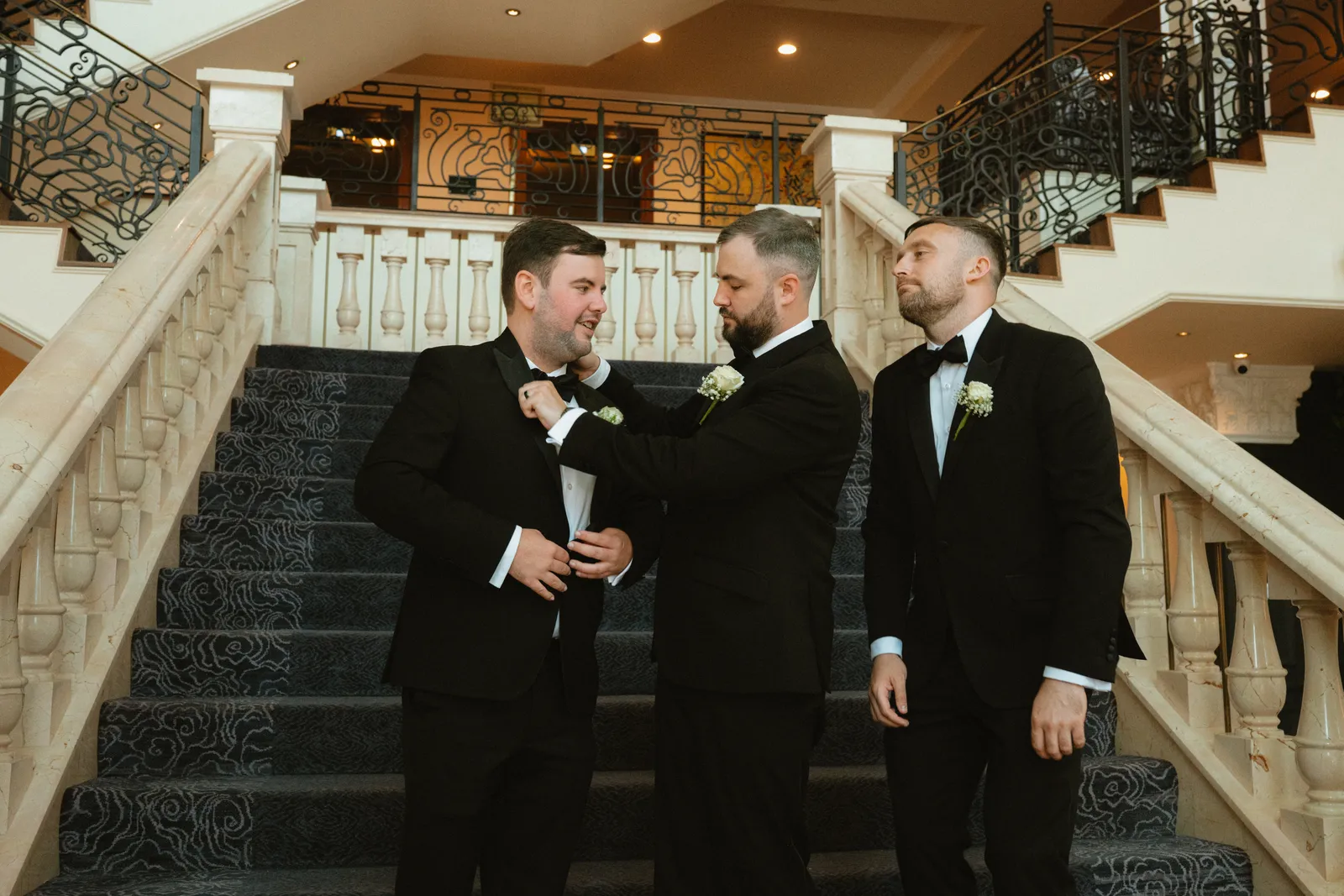Lee with the men on the staircase