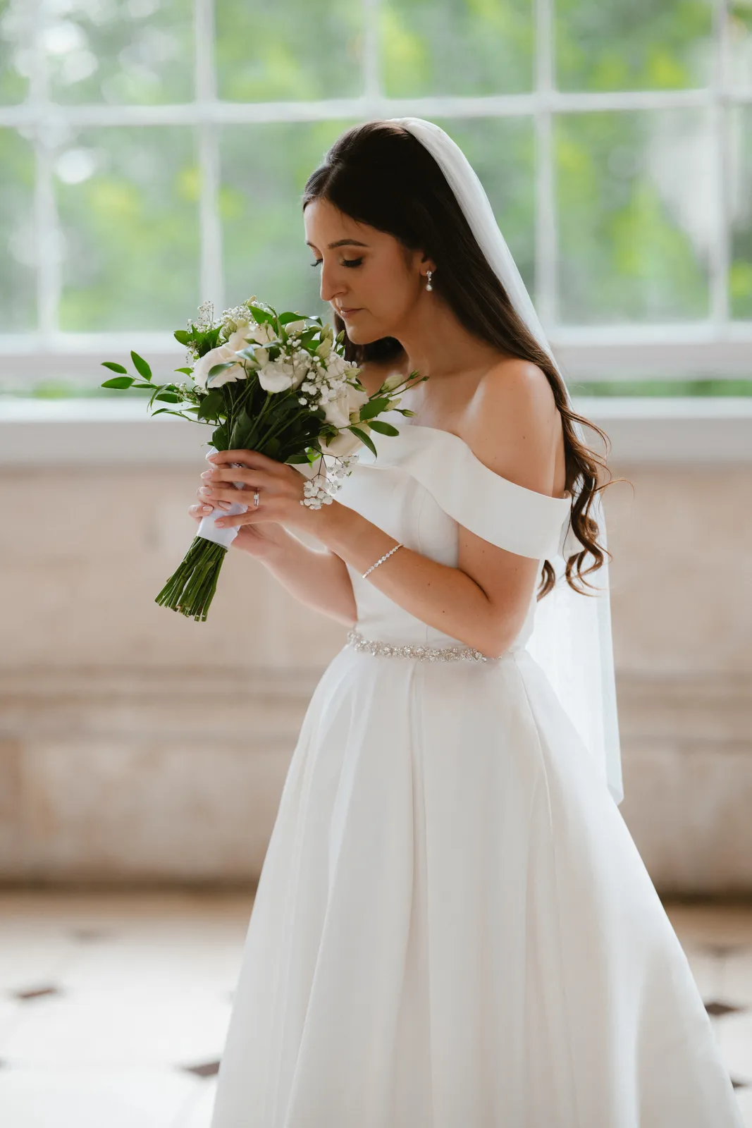 Rebecca holds her bouquet