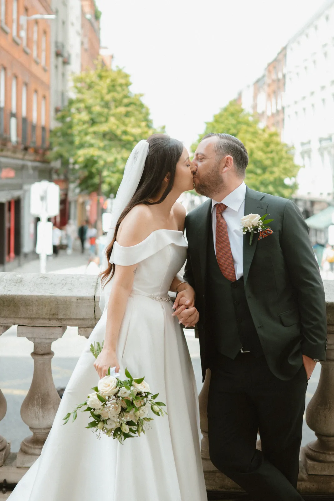 The couple walk along the street