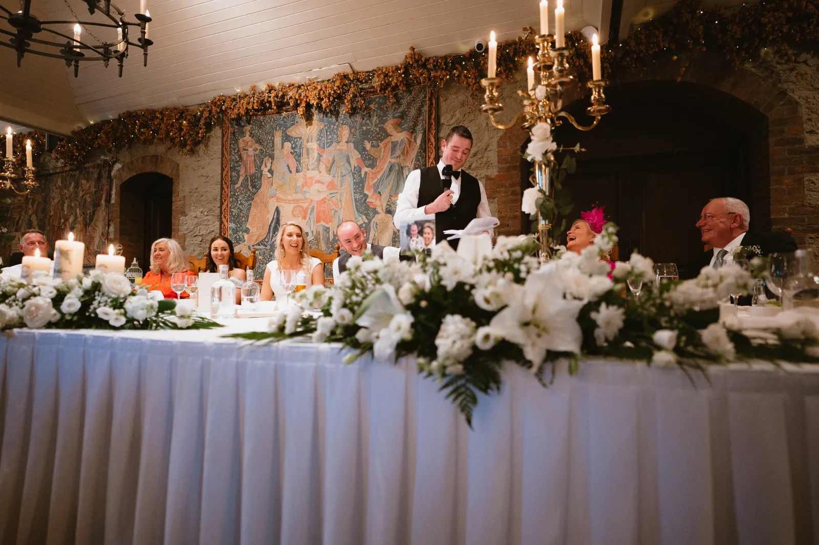 A speech beside the flower-decorated table