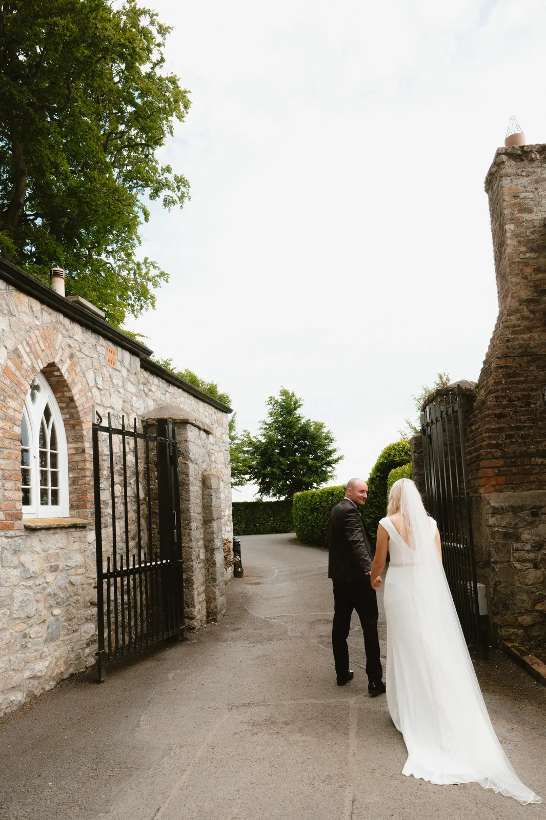 Rebecca and Patrick between stone buildings