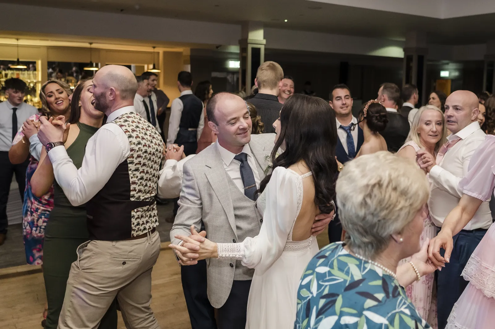 Guests smiling on the dance floor