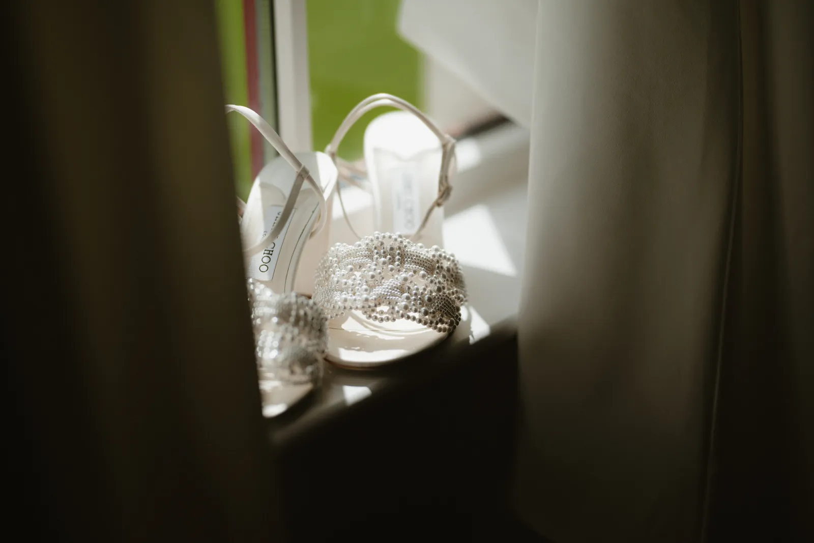 Wedding shoes in the window light