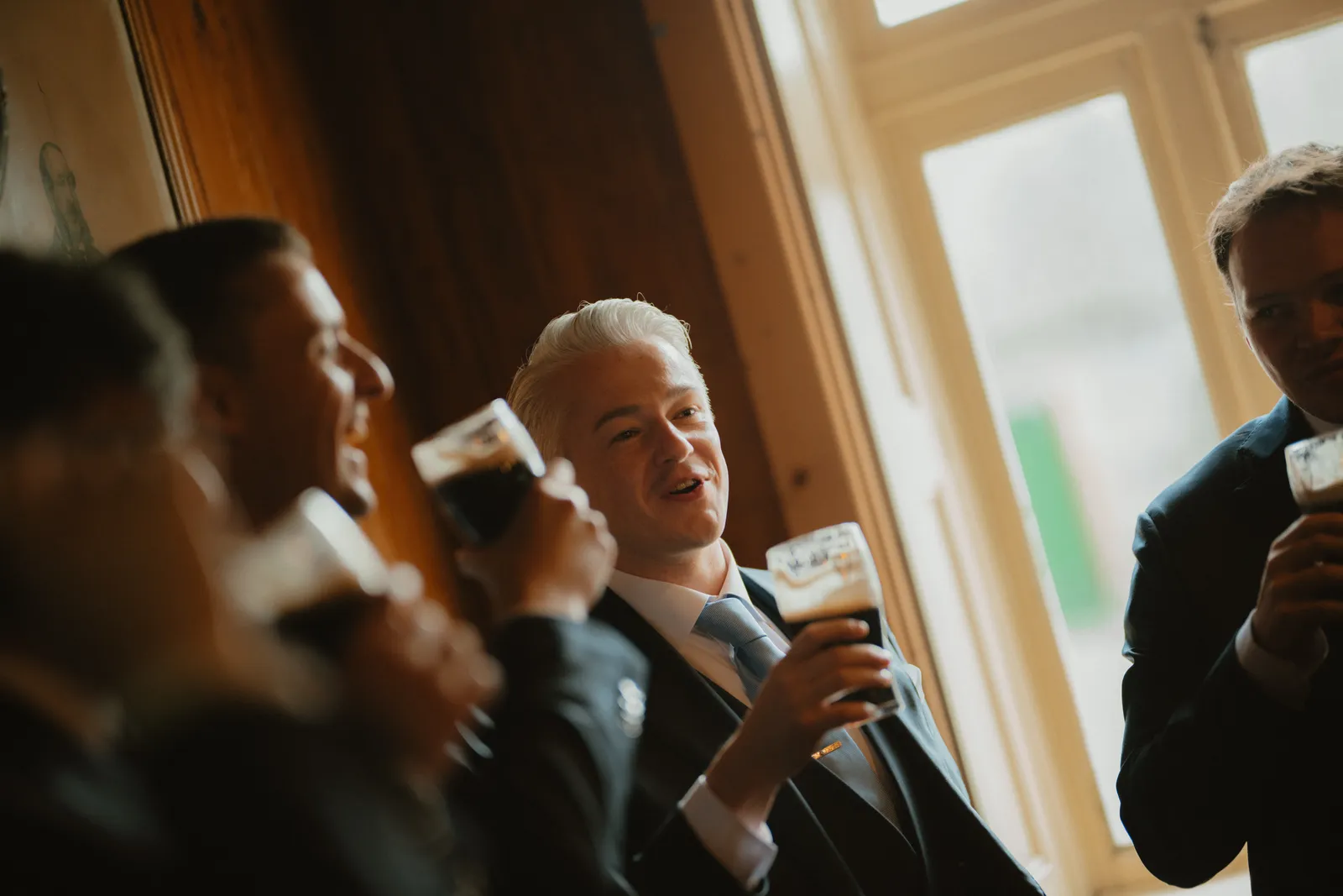 Jack raising a glass with the group
