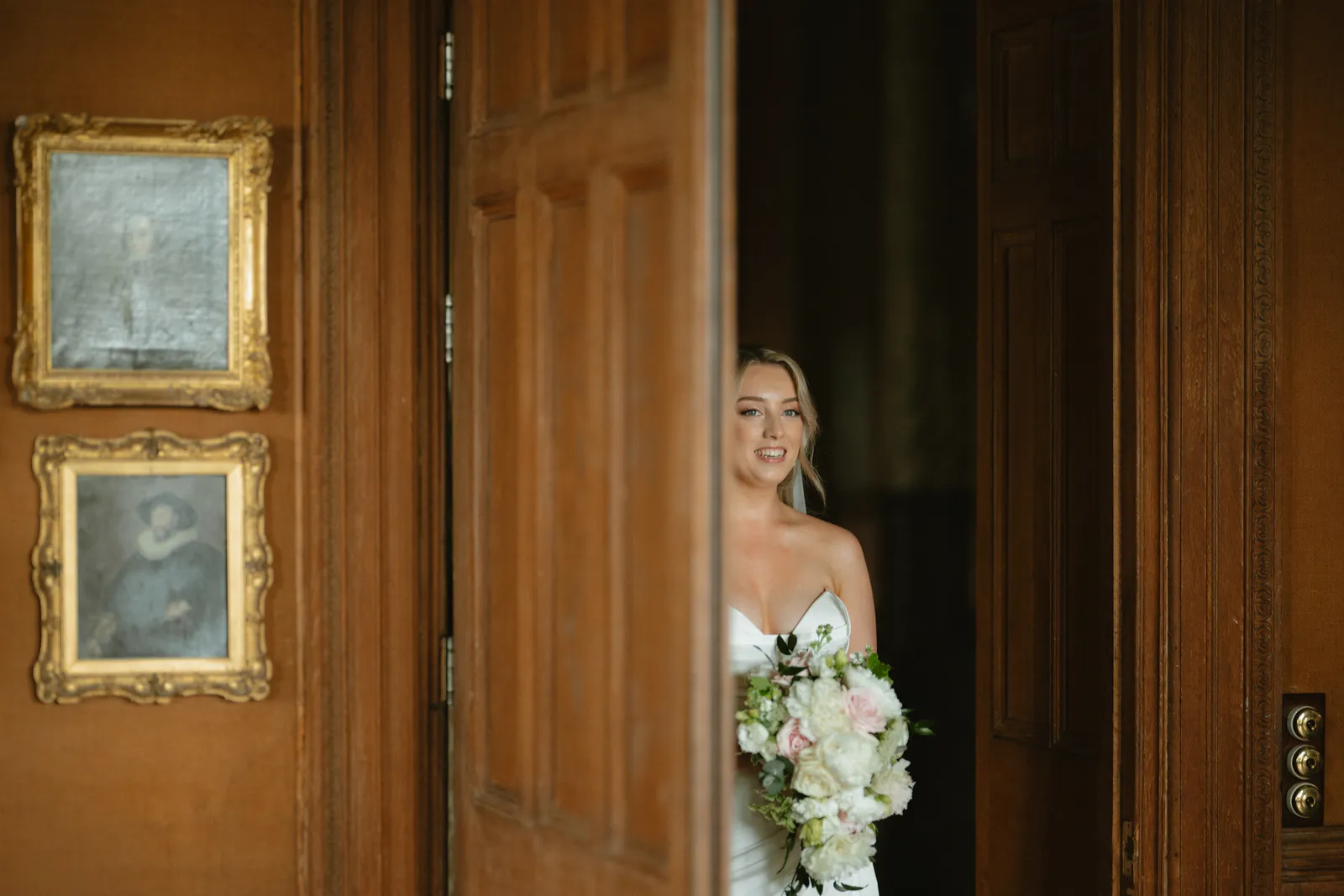 Roslyn waiting in a wooden doorway
