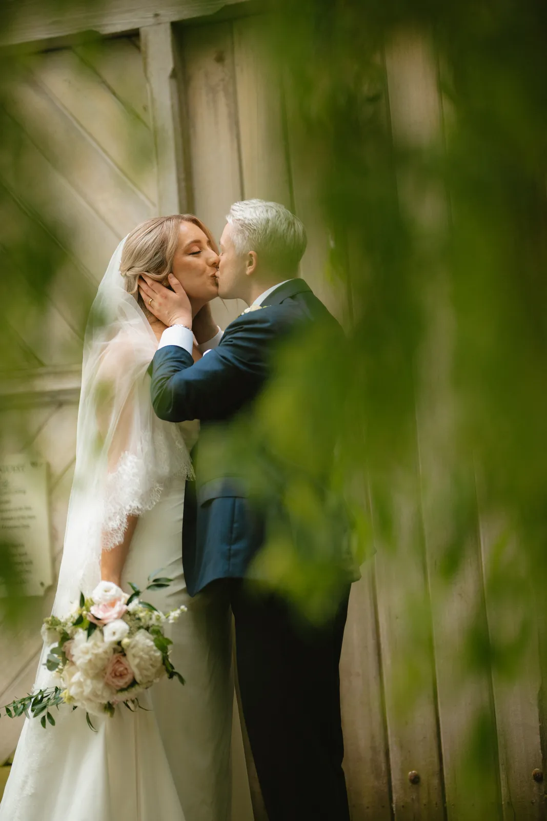 Roslyn and Jack framed by greenery
