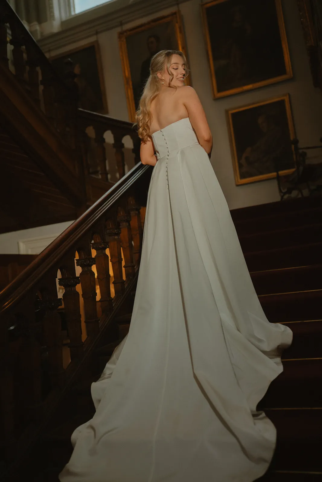 Roslyn and her dress on the staircase
