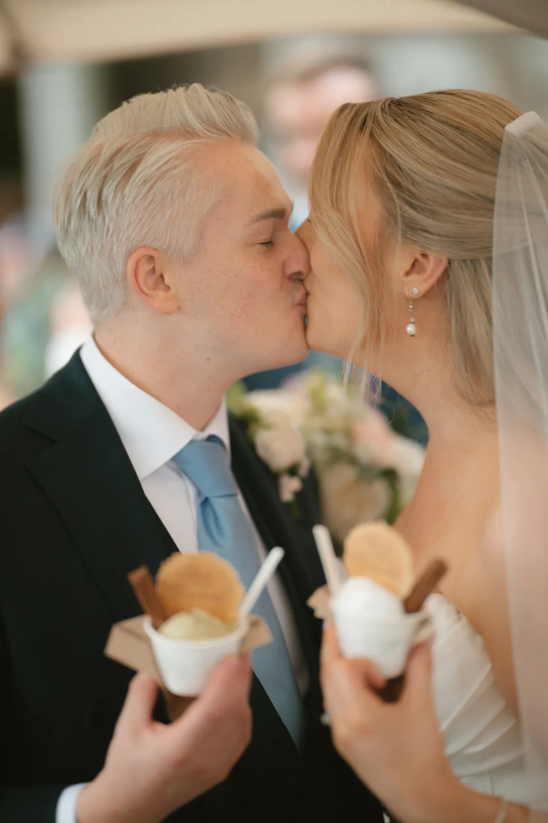 Roslyn and Jack sharing a kiss with ice creams