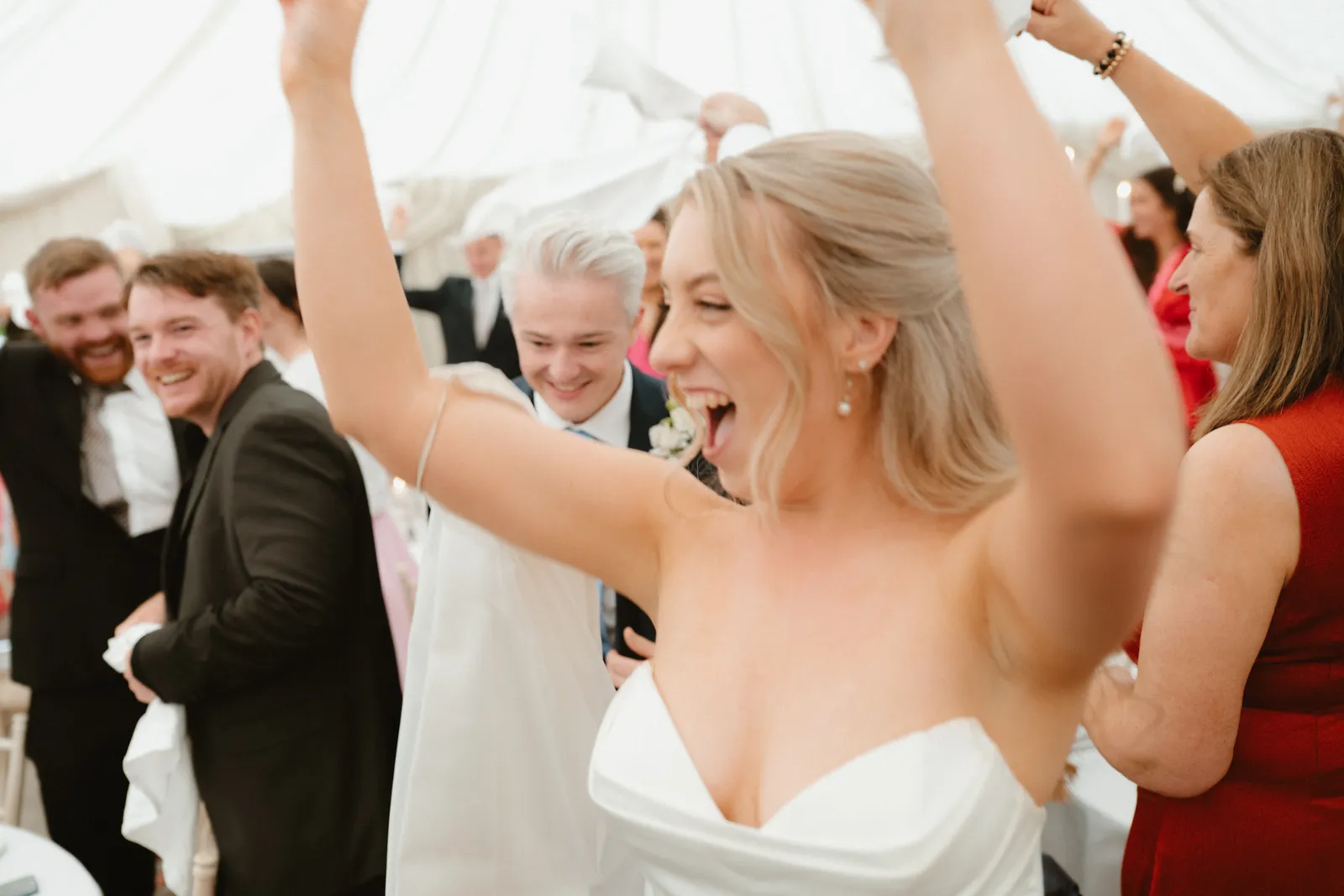 Roslyn raising her arms during the reception