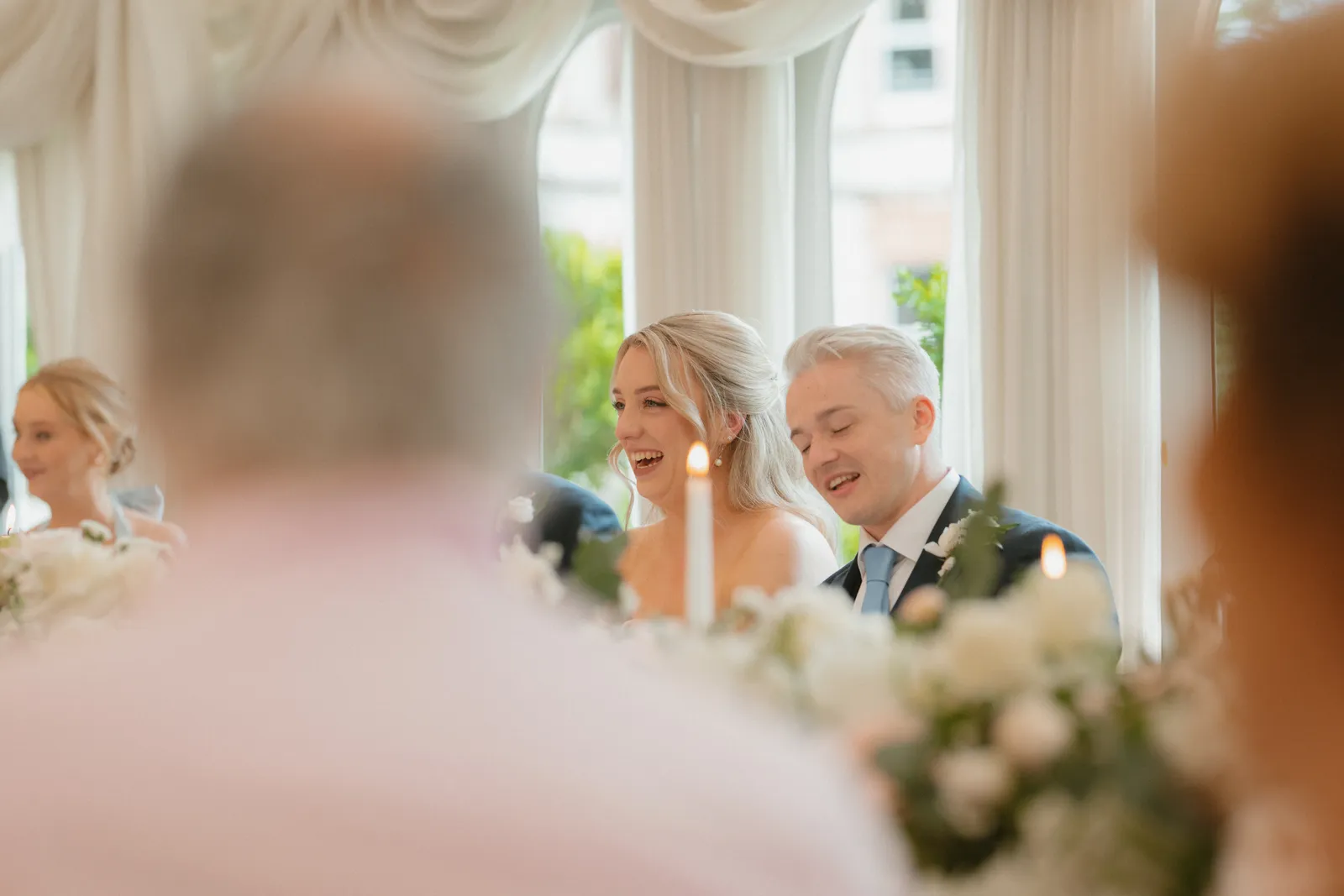 Roslyn and Jack smiling at the table