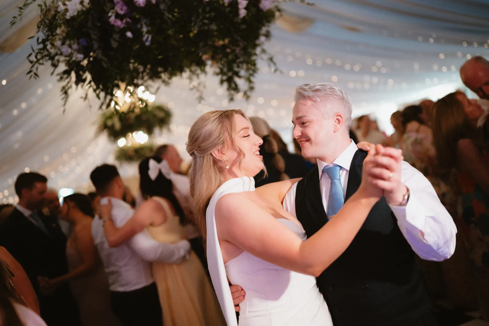 Roslyn and Jack smiling while dancing