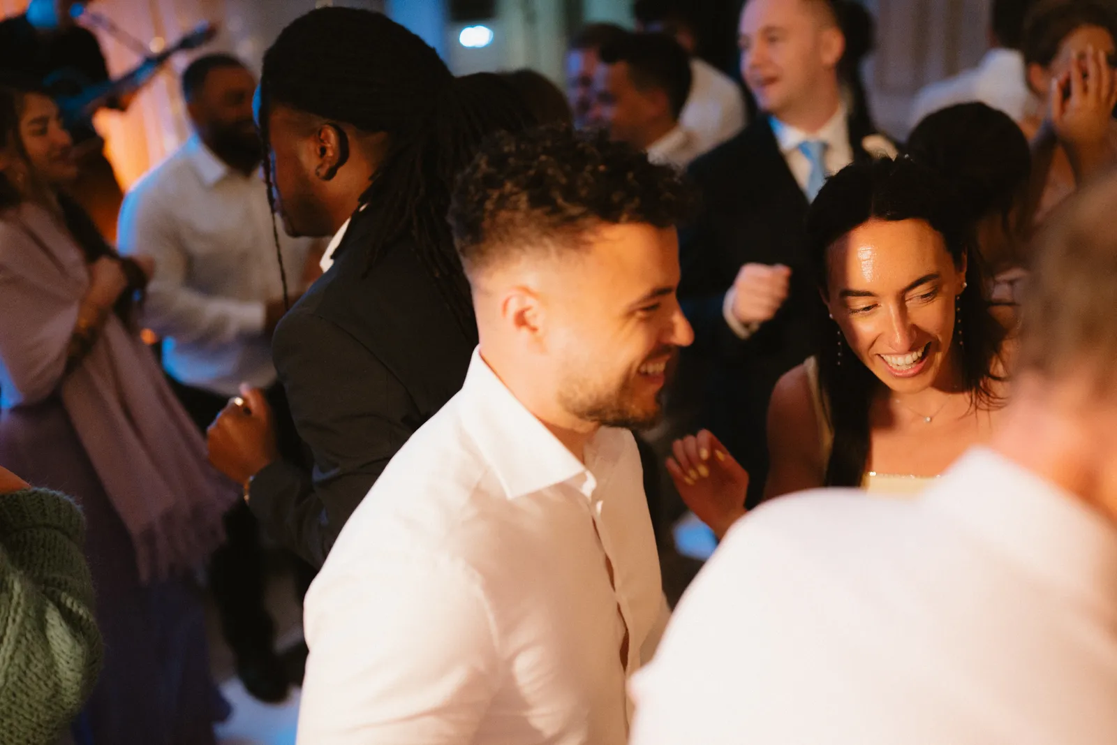 Guests dancing together at the reception