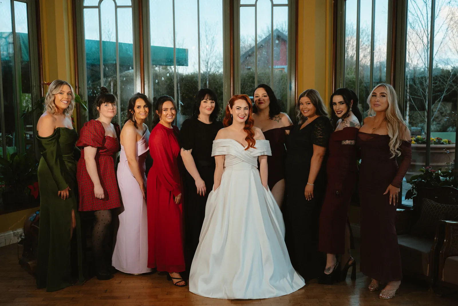 Sarah with a group beside the conservatory windows