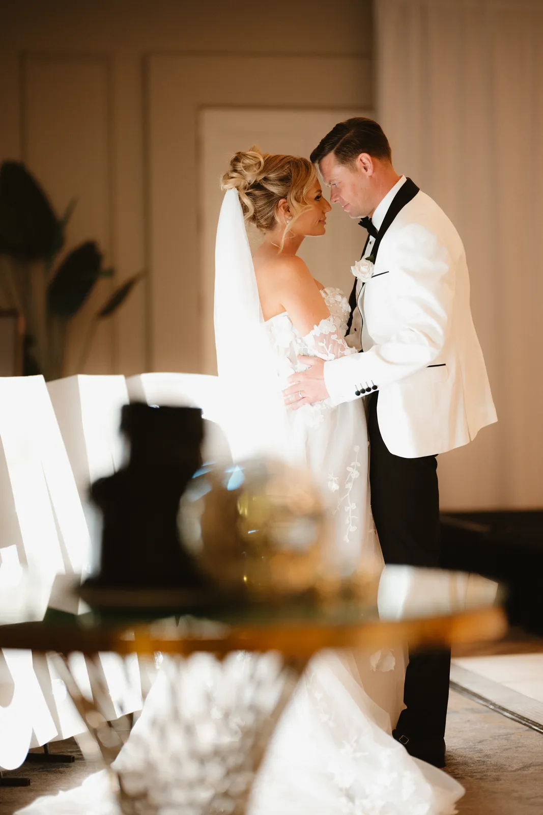 The couple framed by an interior doorway