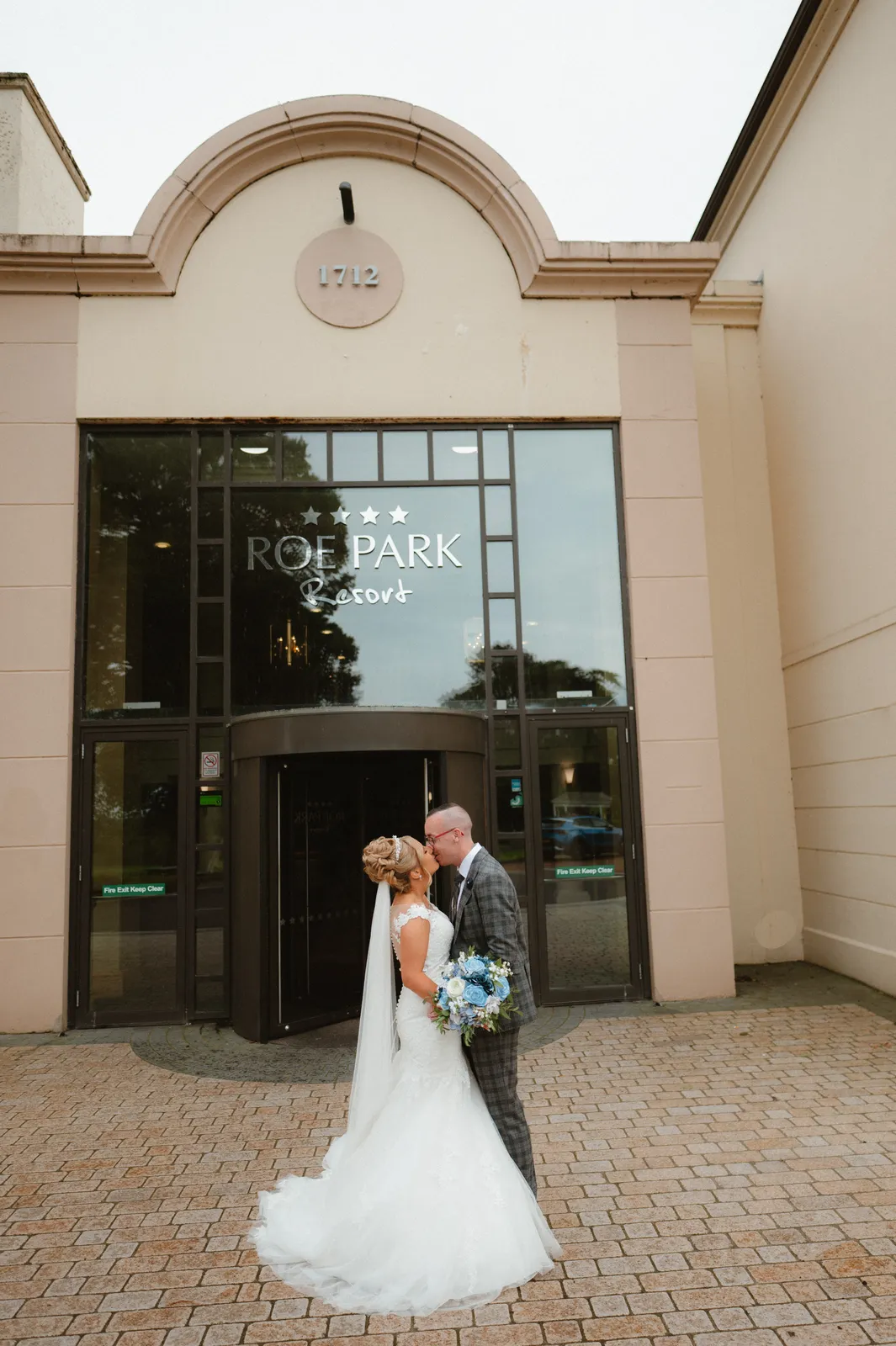 The couple outside the resort entrance
