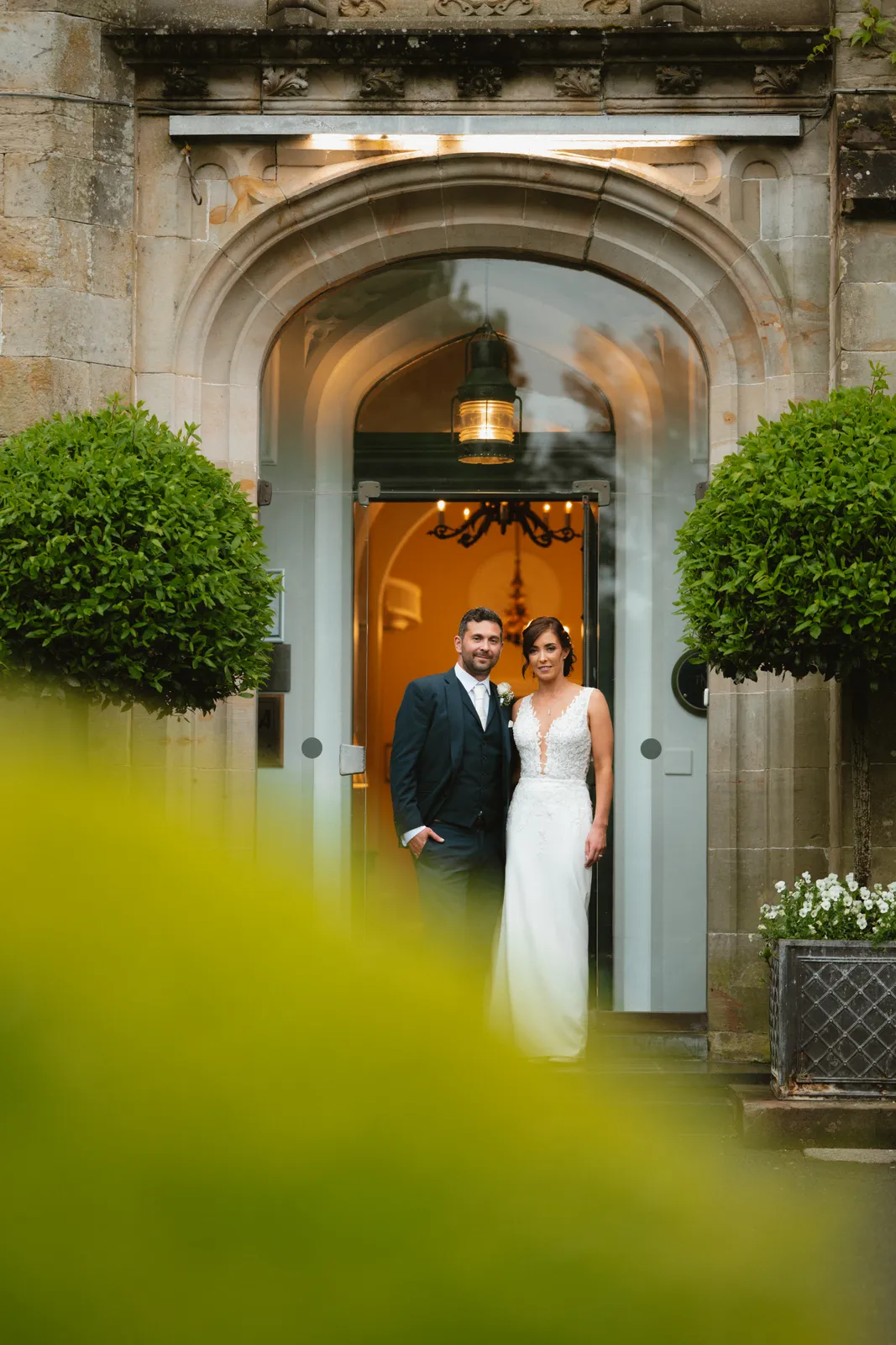 The couple at the stone entrance