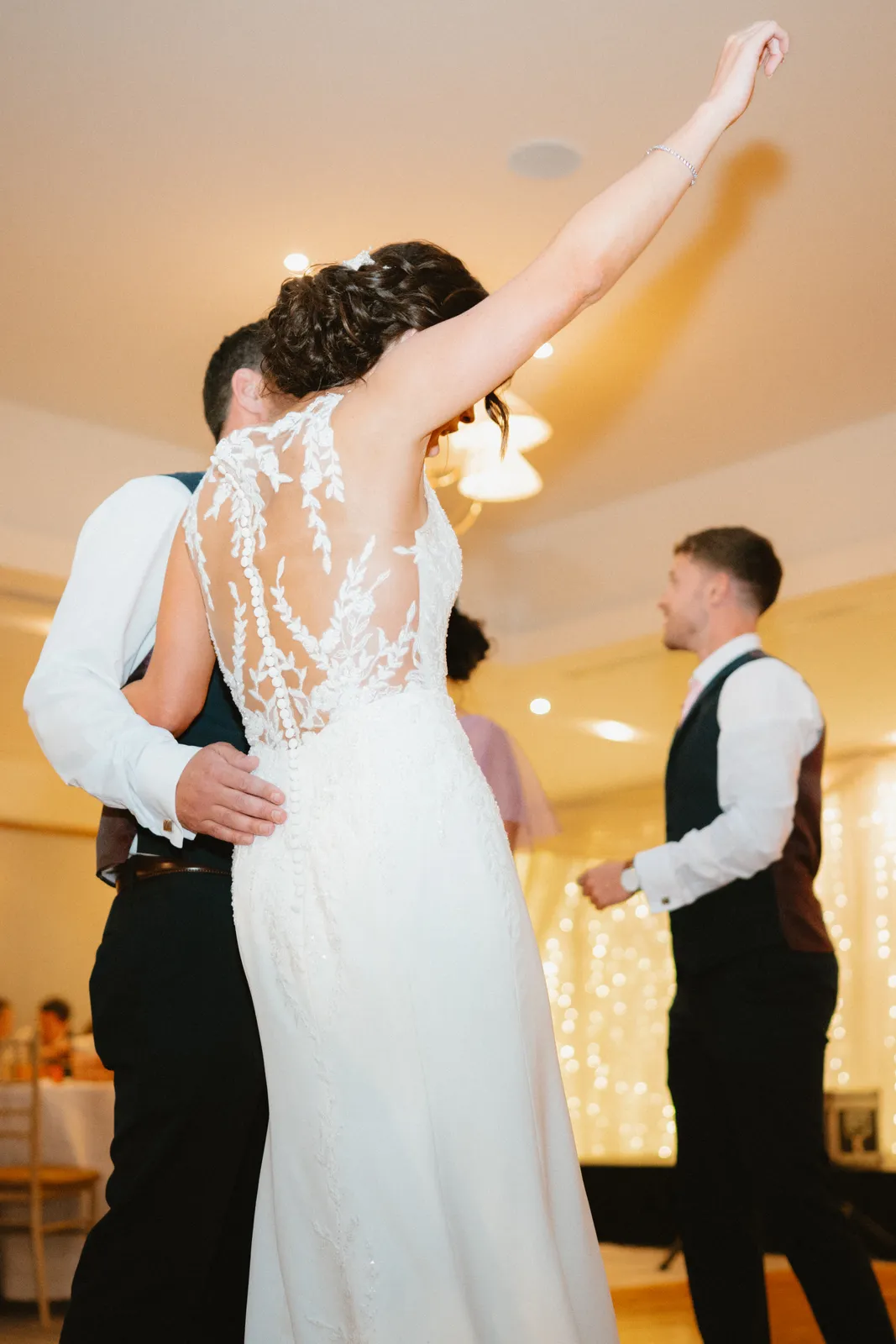 Vicky raises an arm while dancing