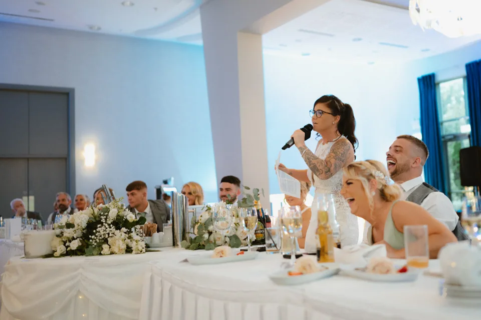 The couple speaking during the reception